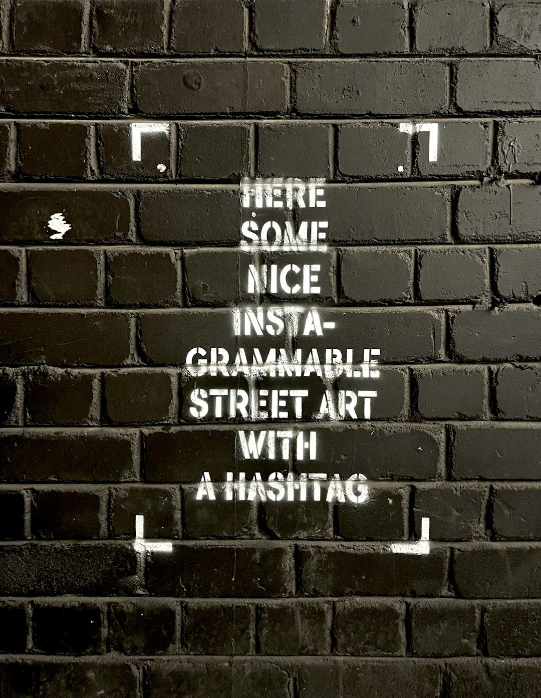 a-brick-wall-with-some-writing-on-it-9aeuzltfl4g